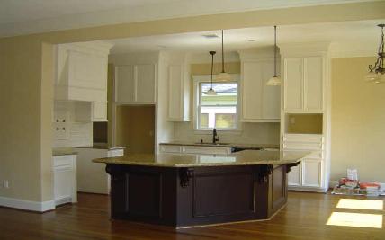 Contemporary Kitchen with White Cabinets, Granite Countertops, and Dark Island