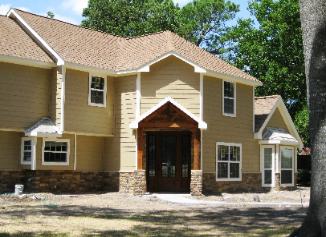 Yellow and Stone House exterior Remodel AfterView