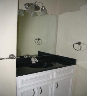 Powder room or Half Bath with Granite Counter in Traditional Style