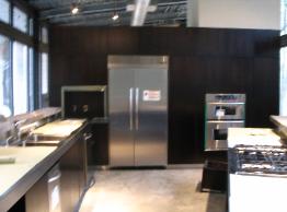 Modern Kitchen with Flat Wood Walls
